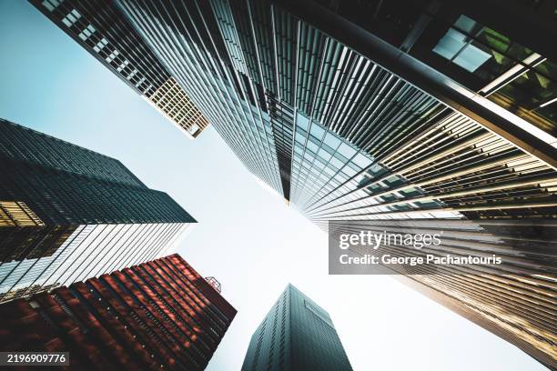 skyscrapers against the clear blue sky - rascacielos fotografías e imágenes de stock