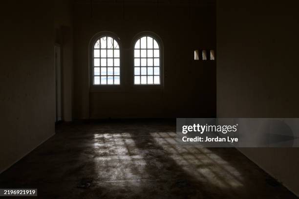 sunlight pours through beautiful gothic windows. - gothic castle stock pictures, royalty-free photos & images