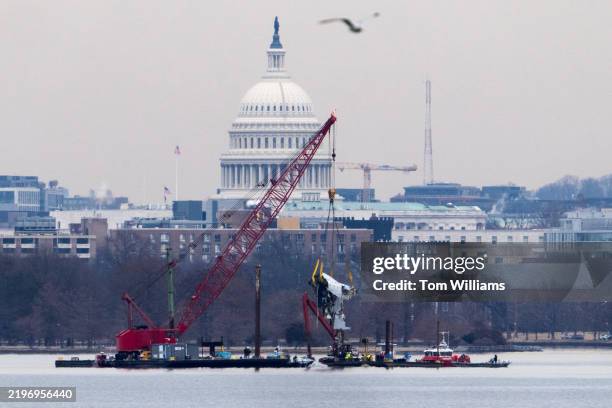 Wreckage from American Airlines flight 5342 is pulled from the Potomac River near Ronald Reagan National Airport on Monday, February 3, 2025. The...