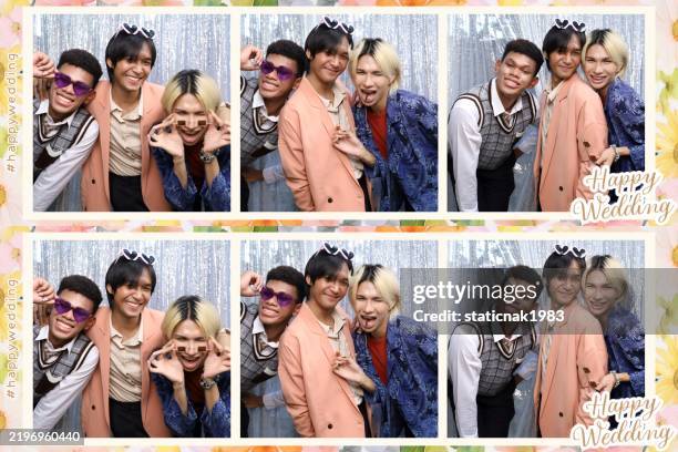 group of lgbtqia+ friends having fun posing with a photo booth at a wedding. - bffs party stock pictures, royalty-free photos & images