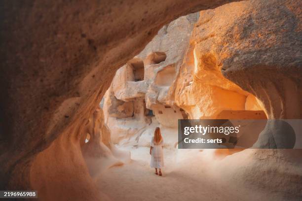 solo traveler exploring the ancient rock formations of pasabag, cappadocia, turkey - capadócia imagens e fotografias de stock