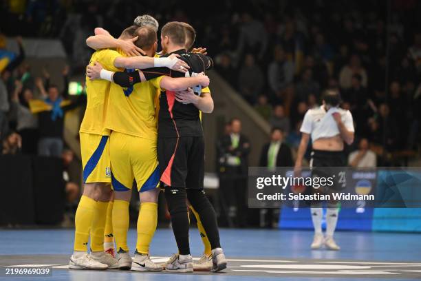 Players of Ukraine celebrate after their team scored their second goal during the UEFA Futsal EURO Qualifier between Germany and Ukraine at EWS Arena...