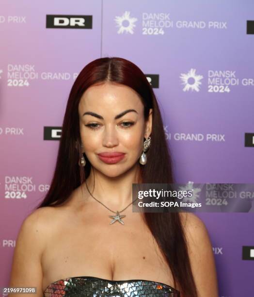 Maria Louise Joensen, aka Aura Dione, prior to Dansk Melodi Grand Prix 2024. She will be performing the song 'Mirrorball of Hope,' which is track...