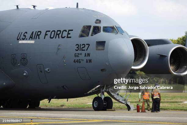 Air force flight carrying deported migrants by the US government arrive at Ramon Villeda Morales International Airport on January 31, 2025 in San...