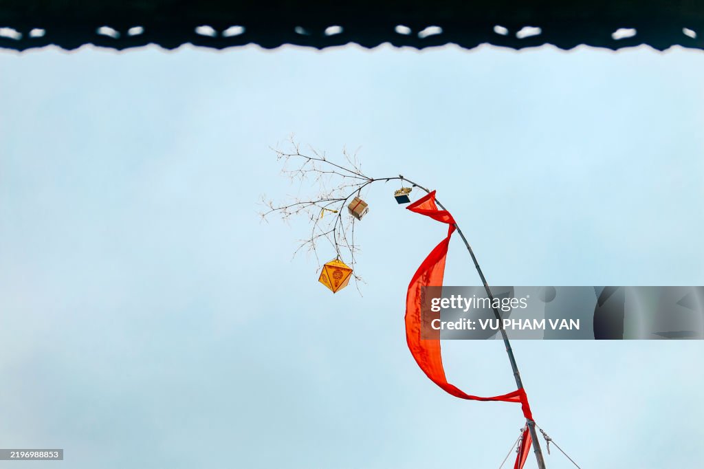 Tet pole standing high up sky in the imperial city of Hue, celebrating Vietnam lunar new year