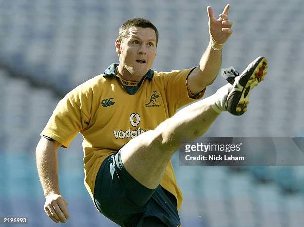 Matt Burke practices his kicking during the Australian Wallabies Captains Run at Telstra Stadium July 25, 2003 in Sydney, Australia.