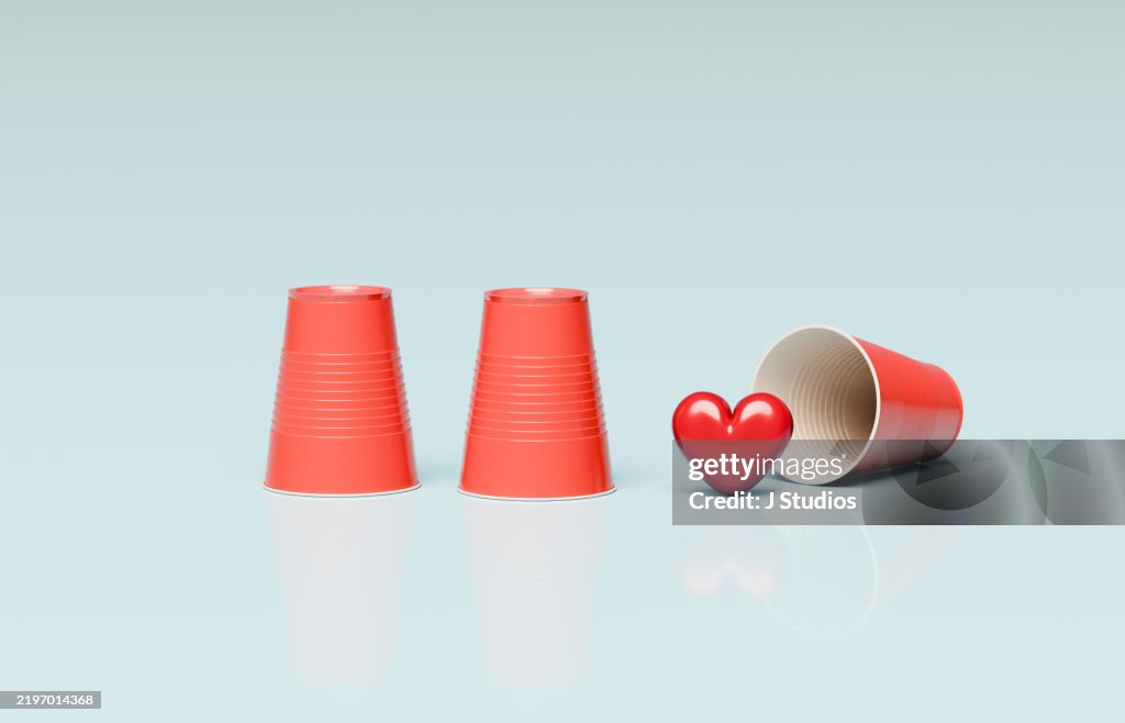 Three Cups with Hidden Red Heart – Love and Surprise on Blue Background