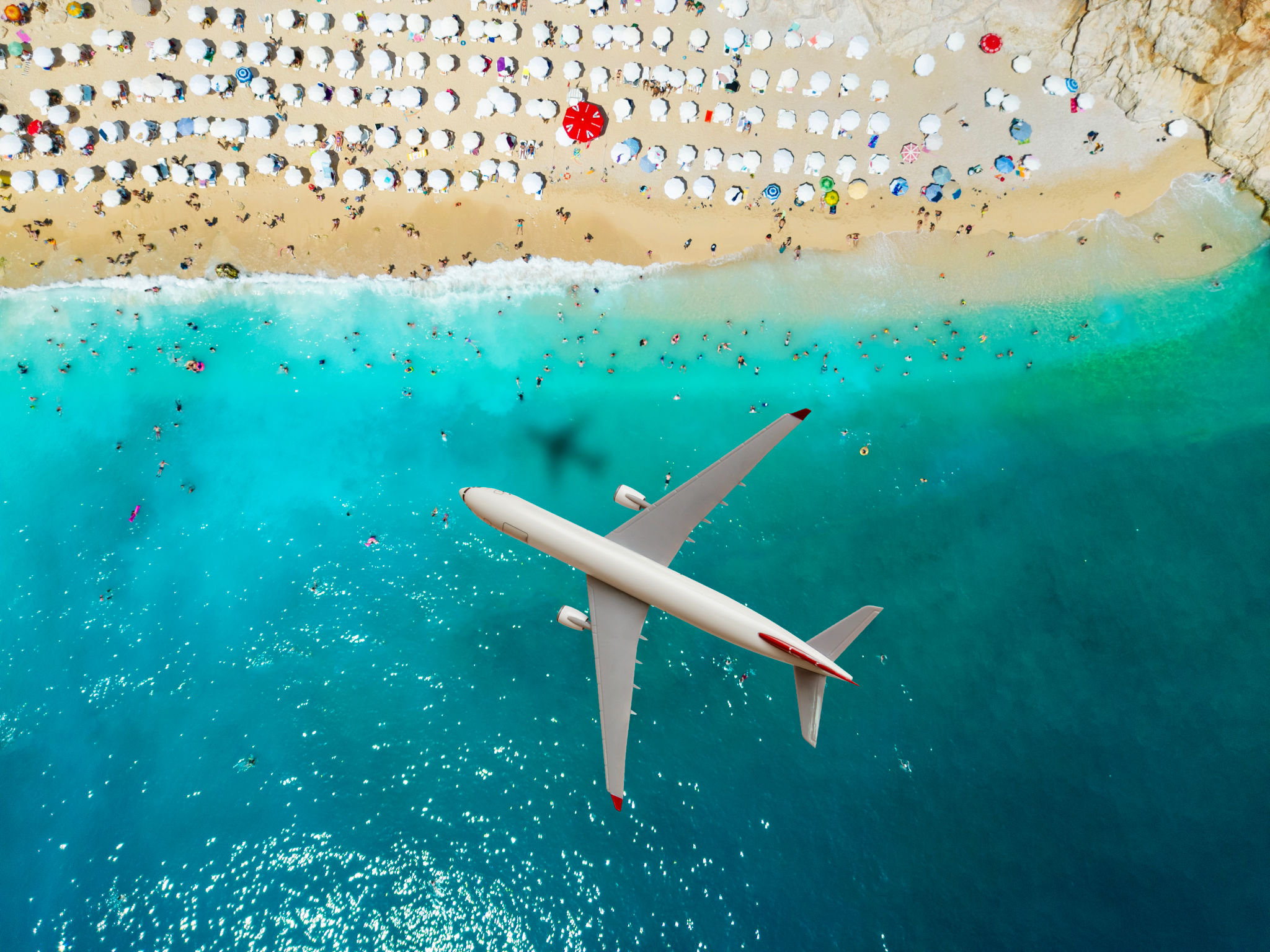 Airplane flying over Kaputas Beach, Antalya, Turkey. Travel concept. Airplane flying over Kaputas Beach, Antalya, Turkey. Travel concept.