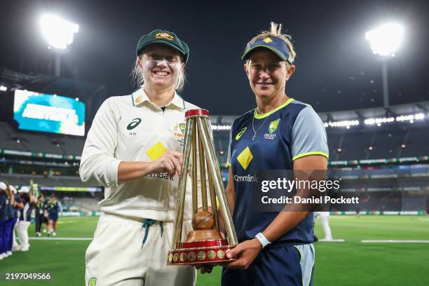 Alyssa Healy of Australia and Shelley Nitschke, head coach of Australia poses for a photograph with the trophy after winning the Women's Ashes Test...