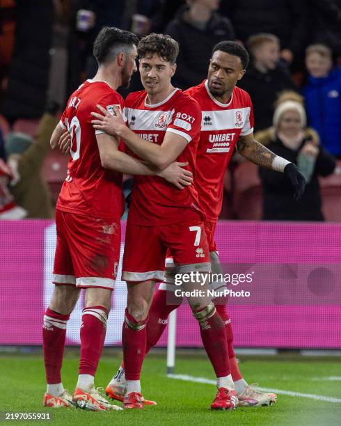 Hayden Hackney of Middlesbrough celebrates with Finn Azaz and Delano Burgzorg after scoring their second goal to level the score at 2-2 during the...