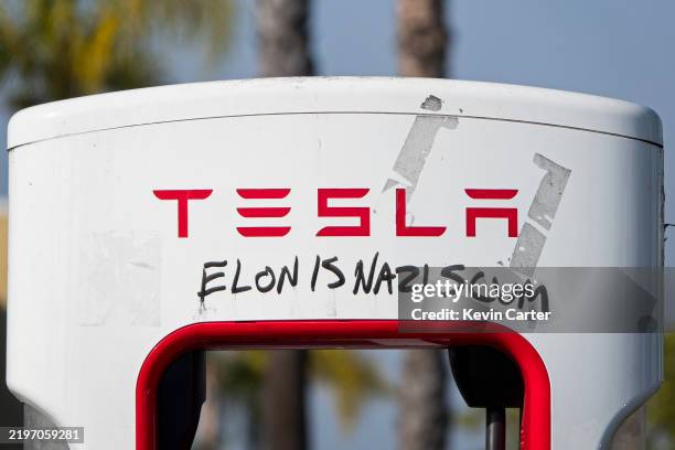 Tesla Supercharger station is vandalized with the words Elon is a Nazi scum on January 31, 2025 in San Diego, California.