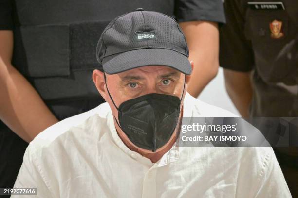 Serge Atlaoui, a Frenchman on death row in Indonesia since 2007 for drug offences, looks on during a press conference at Jakarta's Soekarno-Hatta...