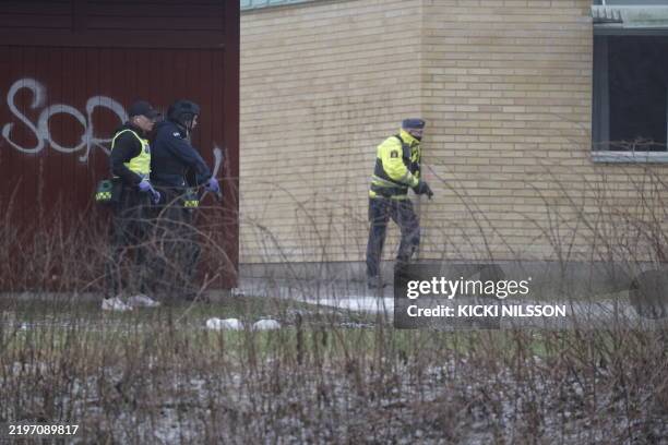 Police officers are seen at the Risbergska School in Orebro, Sweden, on February 4 following reports of a serious violent crime. Four people were...