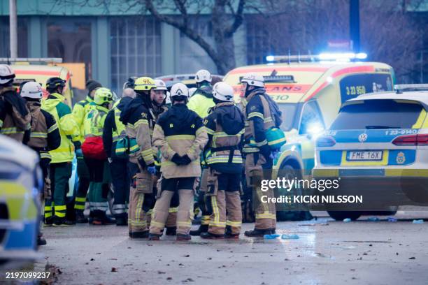 Members of the emergency services work at the scene of the Risbergska School in Orebro, Sweden, on February 4 following reports of a serious violent...