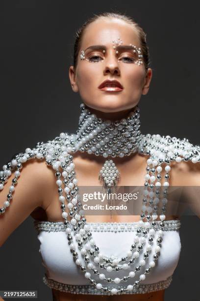 portrait of a beautiful brunette woman wearing pearl jewels - oyster pearl stock pictures, royalty-free photos & images