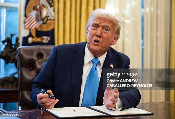 President Donald Trump speaks to the press after signing an executive order withdrawing his country from a number of United Nations bodies in the...