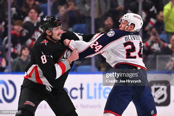 Mathieu Olivier of the Columbus Blue Jackets fights Dennis Gilbert of the Buffalo Sabres at KeyBank Center on February 4, 2025 in Buffalo, New York.