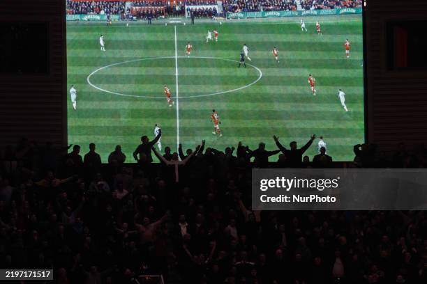 Sunderland's fans are silhouetted against the big screen during the Sky Bet Championship match between Middlesbrough and Sunderland at the Riverside...