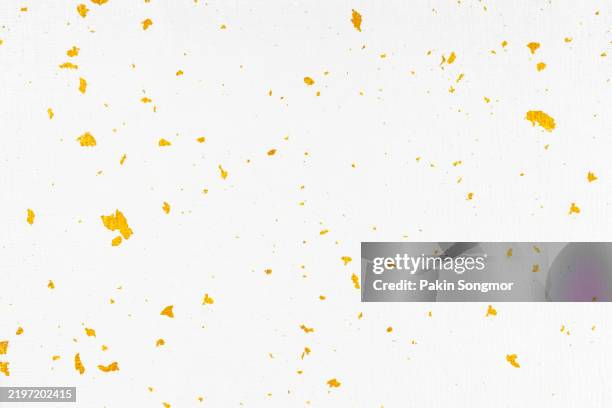glitter gold foil on paper texture as background. - gilded stock pictures, royalty-free photos & images