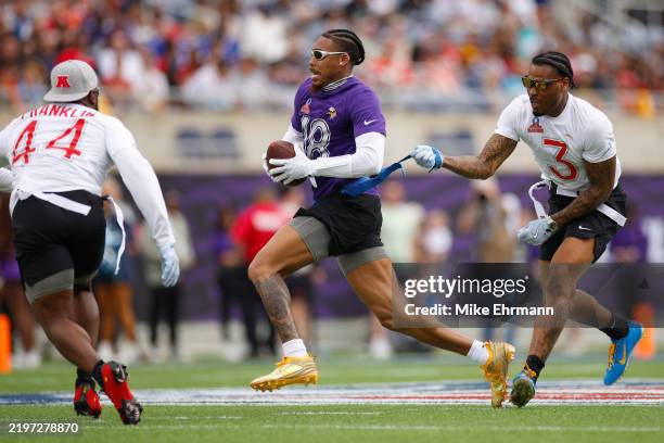 Justin Jefferson of the Minnesota Vikings has his flag pulled by Derwin James Jr. #3 of the Los Angeles Chargers during the first quarter in the NFL...