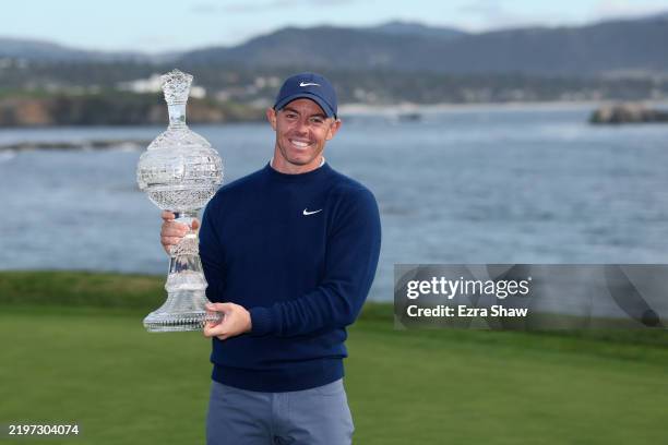Rory McIlroy of Northern Ireland poses with the winner's trophy after winning the AT&T Pebble Beach Pro-Am 2025 at Pebble Beach Golf Links on...