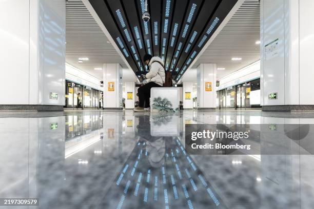 Sequences of binary numbers on the ceiling of a subway station near the Alibaba Group Holding Ltd. Headquarters in Hangzhou, China, on Thursday, Feb....