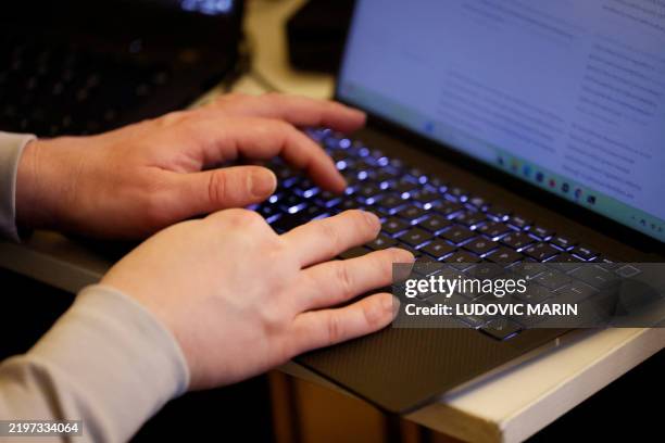 People take part in the "Gen AI hackathon for public good" program on the sidelines of the presentation of the government strategy for AI in the...