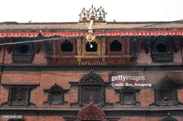 kumari ghar, the house of living goddess kumari, is located on the southern side of the kathmandu durbar square. - nepalese kumari stock pictures, royalty-free photos & images