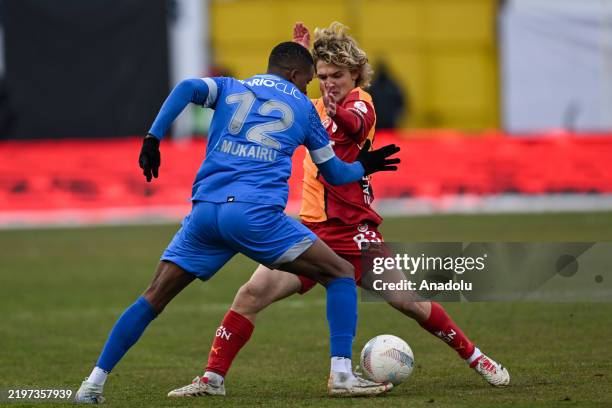 Efe Akman of Galatasaray in action against Paul Omo Mukairu of Boluspor during the Ziraat Turkish Cup Group C week 2 match between Geosis Boluspor...