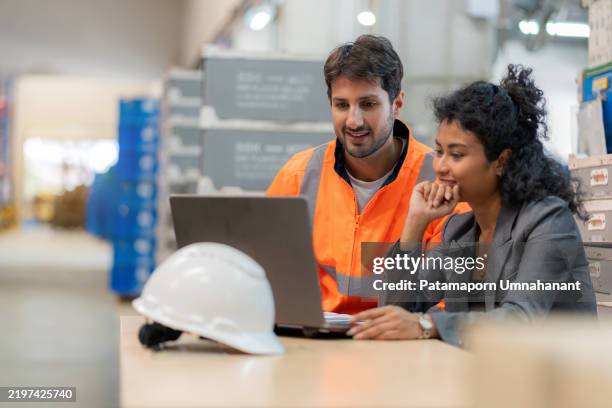 warehouse manager and employee discussing logistics and supply chain improvements using a laptop. industrial teamwork in a distribution center ensuring accuracy, efficiency, and occupational safety. technology-driven inventory control in global business. - coordinator stock pictures, royalty-free photos & images