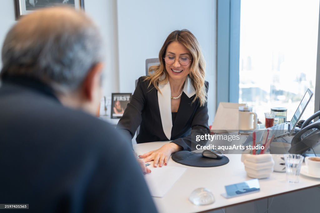 Loan Officer Meeting With Senior Customer