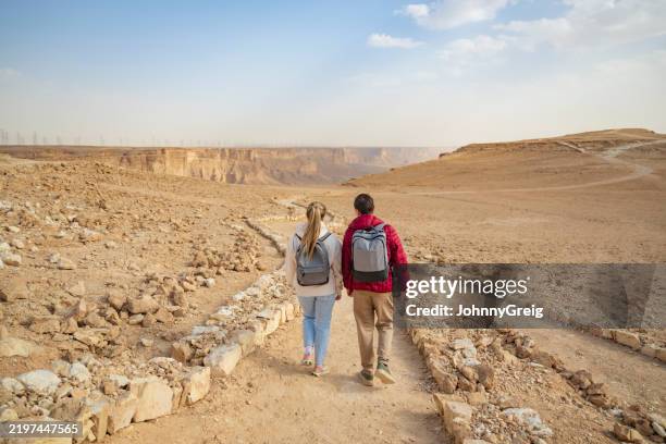 gen z vacationers visiting edge of the world, saudi arabia - eco tourism stock pictures, royalty-free photos & images