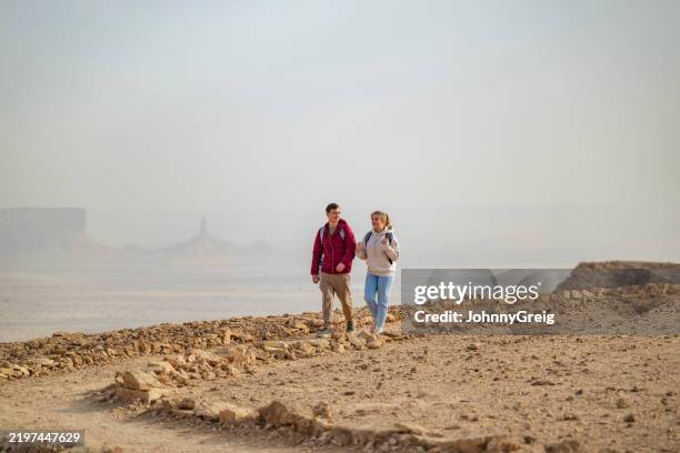 young tourists exploring edge of the world, saudi arabia - eco tourism stock pictures, royalty-free photos & images