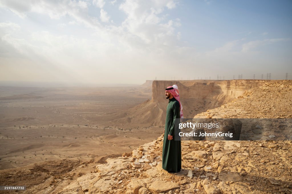 Contemplative man at Edge of the World, Saudi Arabia