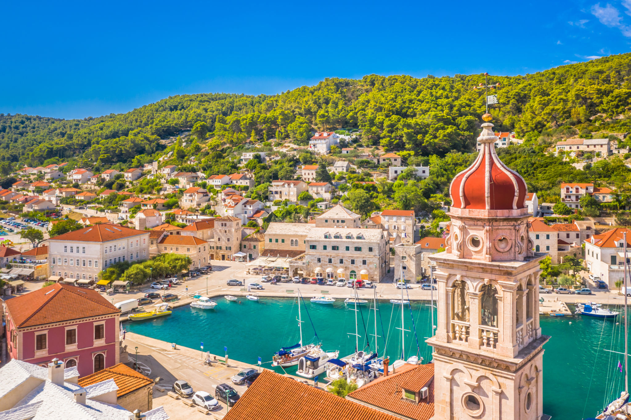 Pucisca on Brac Island with Church Bell Tower and Seaside Village Pucisca on Brac Island with Church Bell Tower and Seaside Village