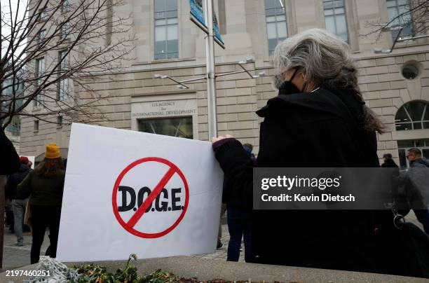 Employees and supporters gather to protest outside of the U.S. Agency for International Development headquarters on February 03, 2025 in Washington,...