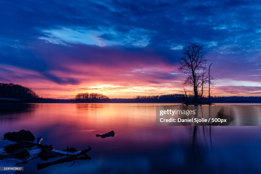 Scenic view of lake against orange sky,Baltimore County,Maryland,United States,USA