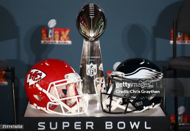 Kansas City Chiefs helmet, the Vince Lombardi Trophy and a Philadelphia Eagles helmet are seen before the NFL Commissioner Roger Goodell's Super Bowl...