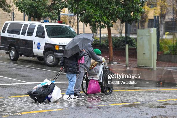 Homeless While Raining Homeless people are seen during heavy rain in Tenderloin district of ...