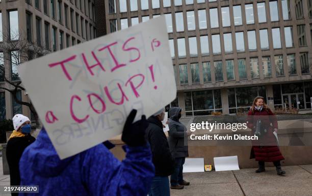 Protesters gather outside of the Theodore Roosevelt Federal Building headquarters of the U.S. Office of Personnel Management on February 03, 2025 in...