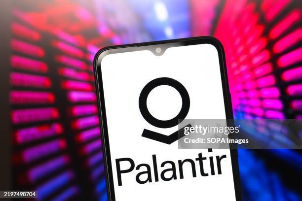 In this photo illustration, the Palantir Technologies logo is seen displayed on a smartphone screen.