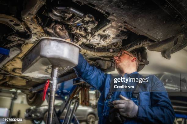 no title found - contact support - engine oil change stock pictures, royalty-free photos & images