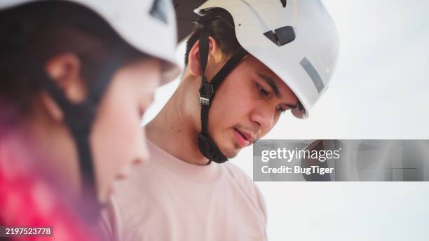 engineers working in the field at the solar panel control unit. - job selection stock pictures, royalty-free photos & images