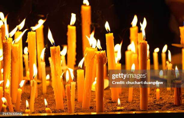 close-up of candle burning for celebrations - candlelight stock pictures, royalty-free photos & images