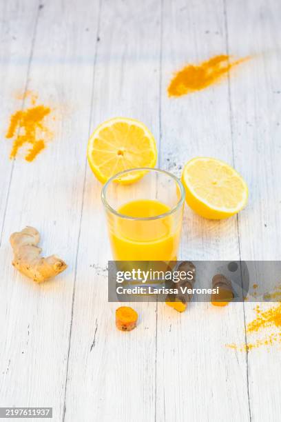 ginger shot - tumeric root stock pictures, royalty-free photos & images