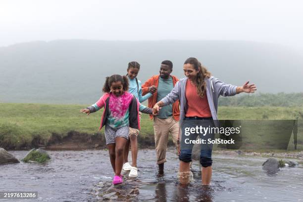 carefree family bonding in nature’s embrace - adventure stock pictures, royalty-free photos & images