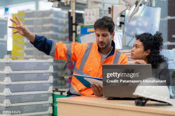 data-driven warehouse management: manager and controller discussing inventory optimization using technology. supply chain, logistics, digital transformation, and efficiency in a large-scale distribution center. freight transportation and industrial expert - digital transformation stock pictures, royalty-free photos & images