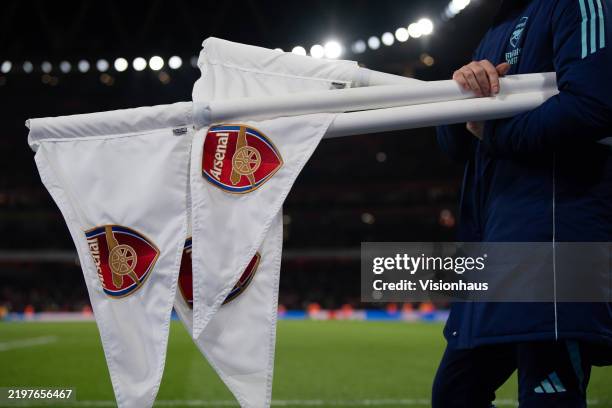 Ground staff collecting corner flags after the Premier League match between Arsenal FC and Manchester City FC at Emirates Stadium on February 02,...