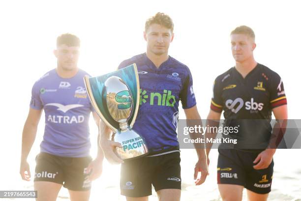 Beauden Barrett of the Blues with the Super Rugby trophy during the 2025 Super Rugby Season Launch at Little Bay Beach on February 05, 2025 in...