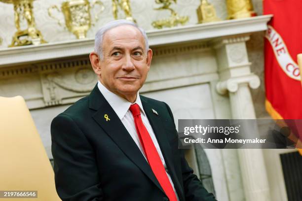 Israeli Prime Minister Benjamin Netanyahu appears during a meeting with U.S. President Donald Trump in the Oval Office of the White House on February...